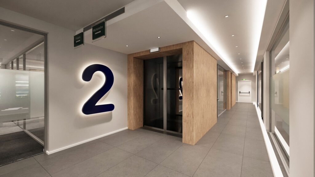 Modern Kurumsal Ofis Tasarımı Aydınlatmalı kat numarası ve ahşap kaplamalarla tasarlanmış, modern ofis girişi ve koridoru.