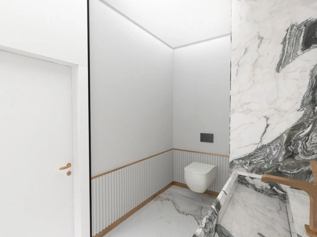 Modern Penthouse Tasarımı Mermer duvar paneli, yuvarlak hatlı lavabo ve beyaz seramiklerle minimalist bir banyo.