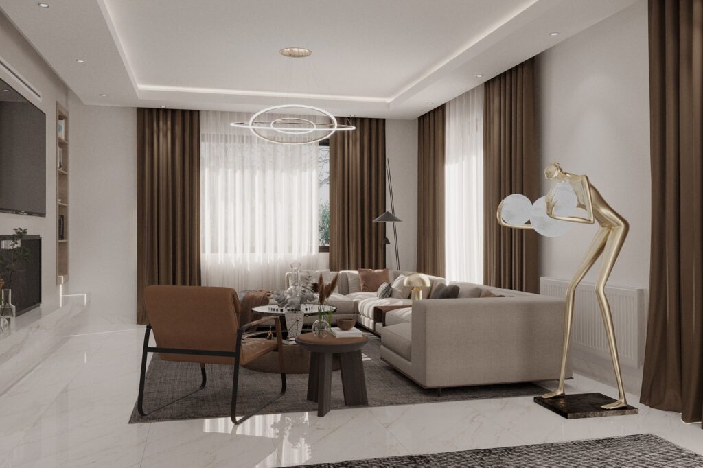 Açık tonlardaki mobilyalar, kahve rengi perdeler ve modern sanat eseri heykelleriyle dekore edilmiş geniş salon.