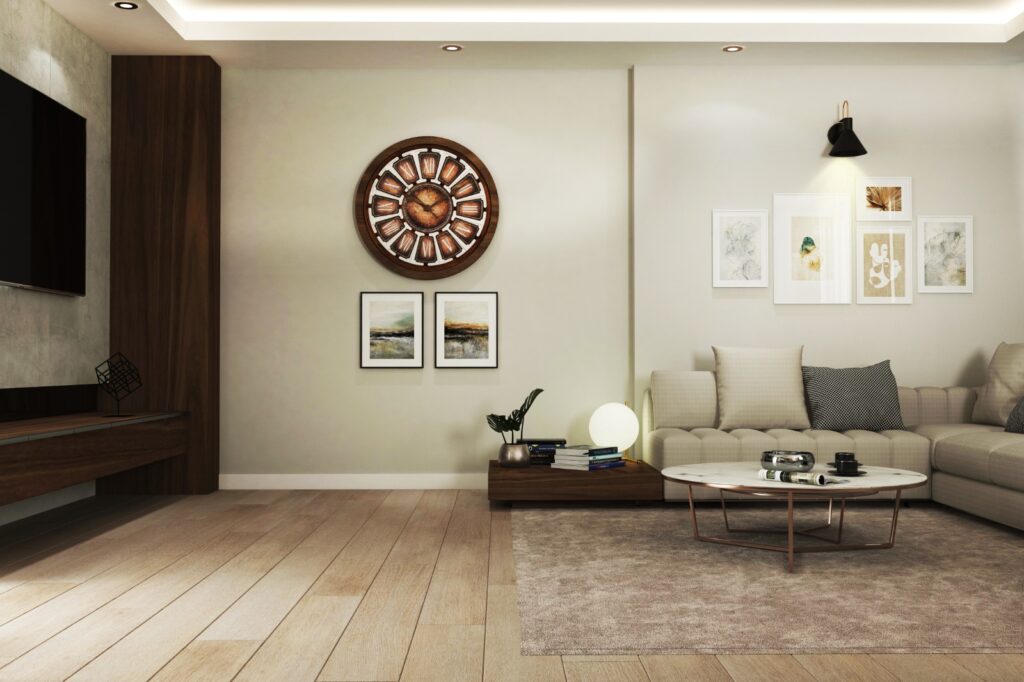 Duvar saatli, ahşap zeminli ve modern sanat eserleriyle dekore edilmiş oturma alanı renderı.