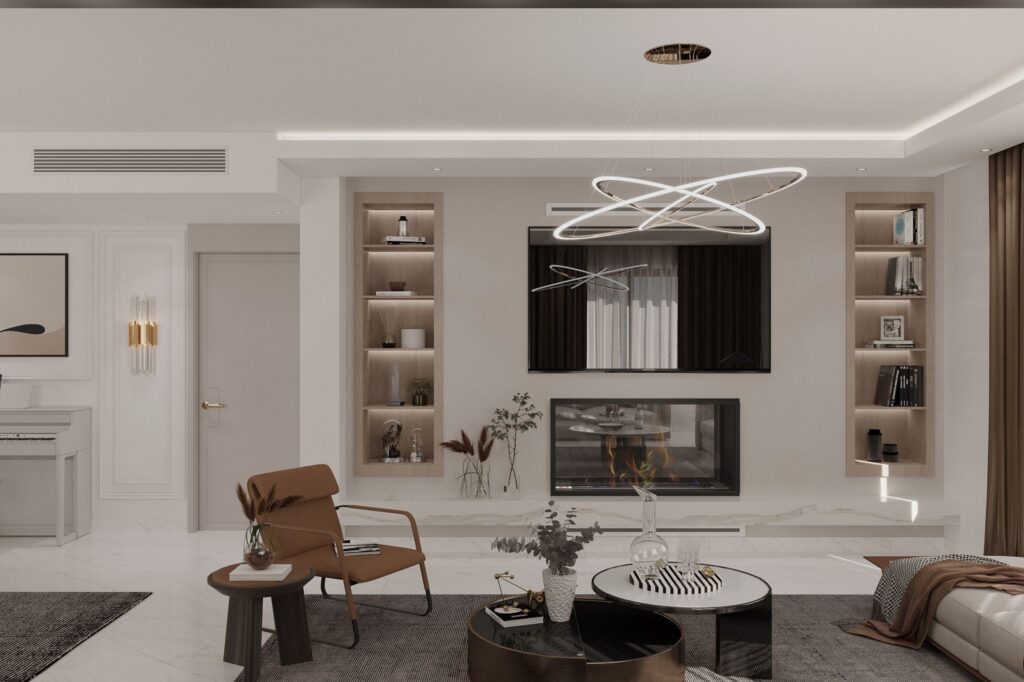 Mermer dokulu şöminesi, açık raflı kütüphane ve modern mobilyalarla tasarlanmış villa salonu.