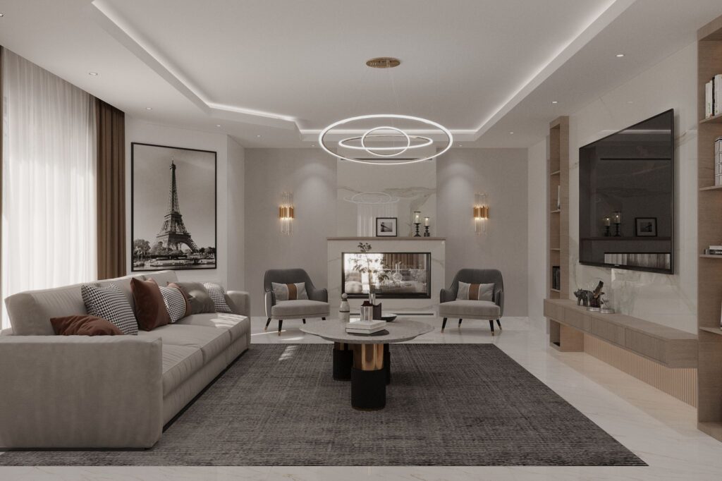 Modern şömineli, lüks koltuklar ve duvar resimleriyle tasarlanmış villa salonu.