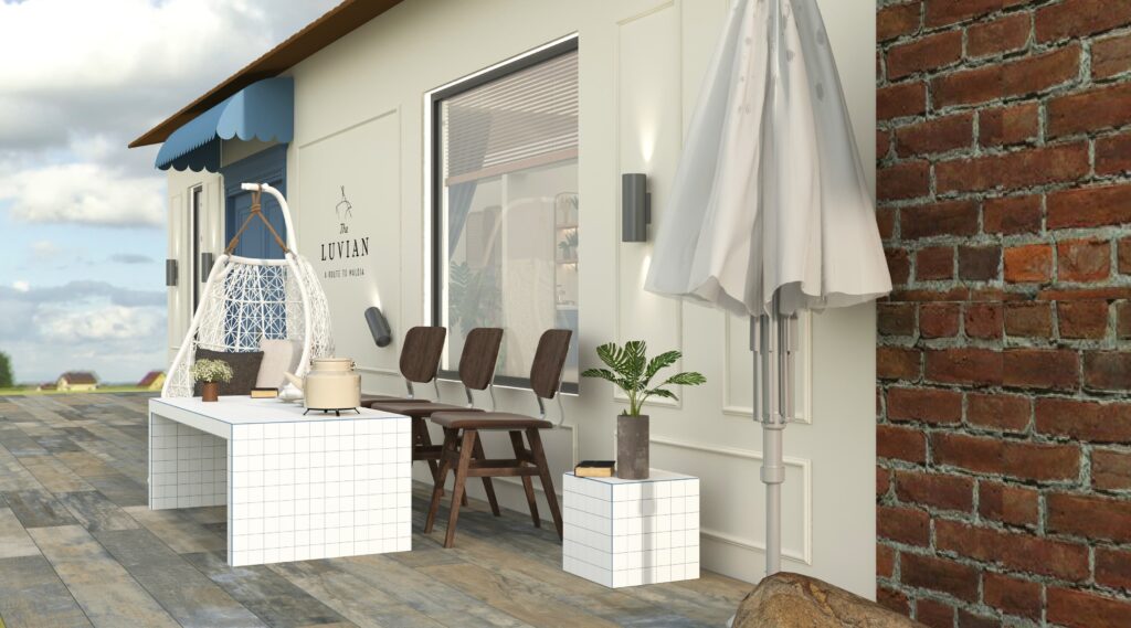 Butik Kafe Tasarımı Beyaz fayanslı masa ve salıncak sandalyenin yer aldığı, şık bir kafe dış oturma alanı.