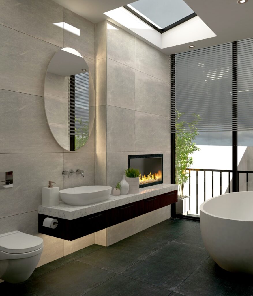 Geniş pencereli, şömine detaylı, oval küvetli ve modern banyo mobilyalı lüks bir banyo.