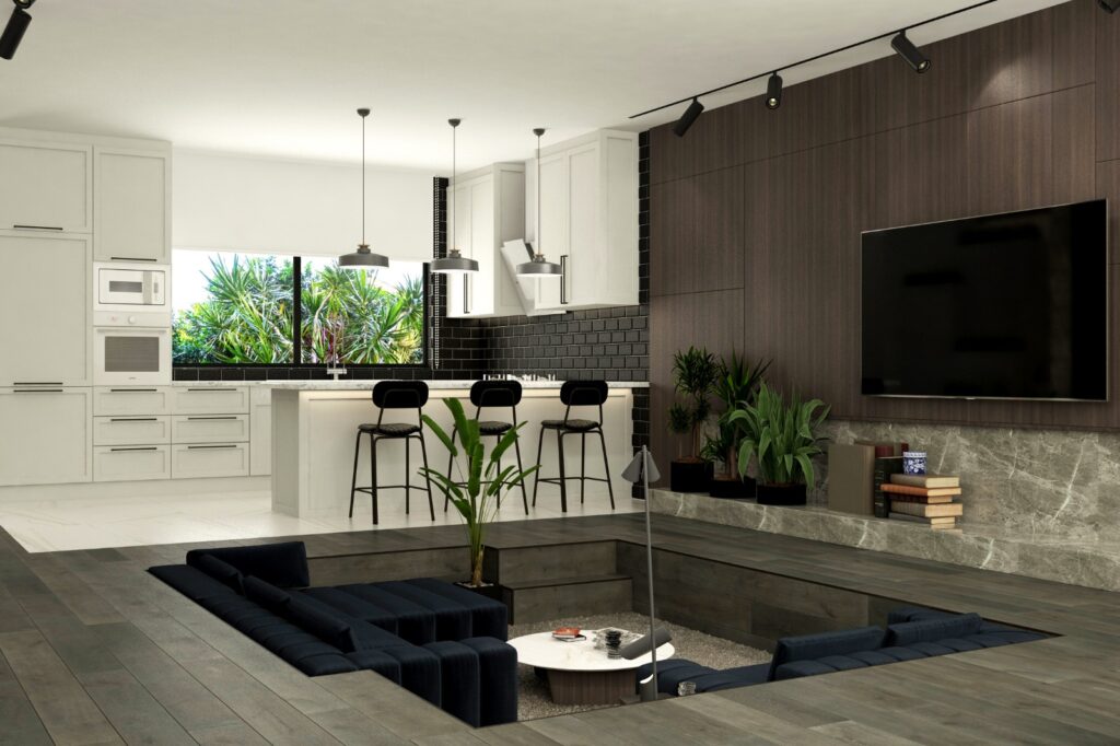 Aile Dostu Modern Villa Tasarımı Batık oturma alanı, modern mutfak ve TV ünitesiyle tasarlanmış, geniş ve ferah bir iç mekan.