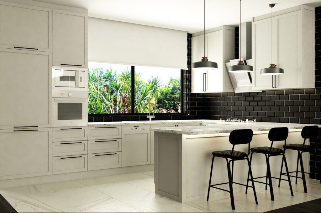 Aile Dostu Modern Villa Tasarımı Beyaz mutfak dolapları, siyah seramik duvar ve mutfak adasıyla tasarlanmış, modern bir mutfak.