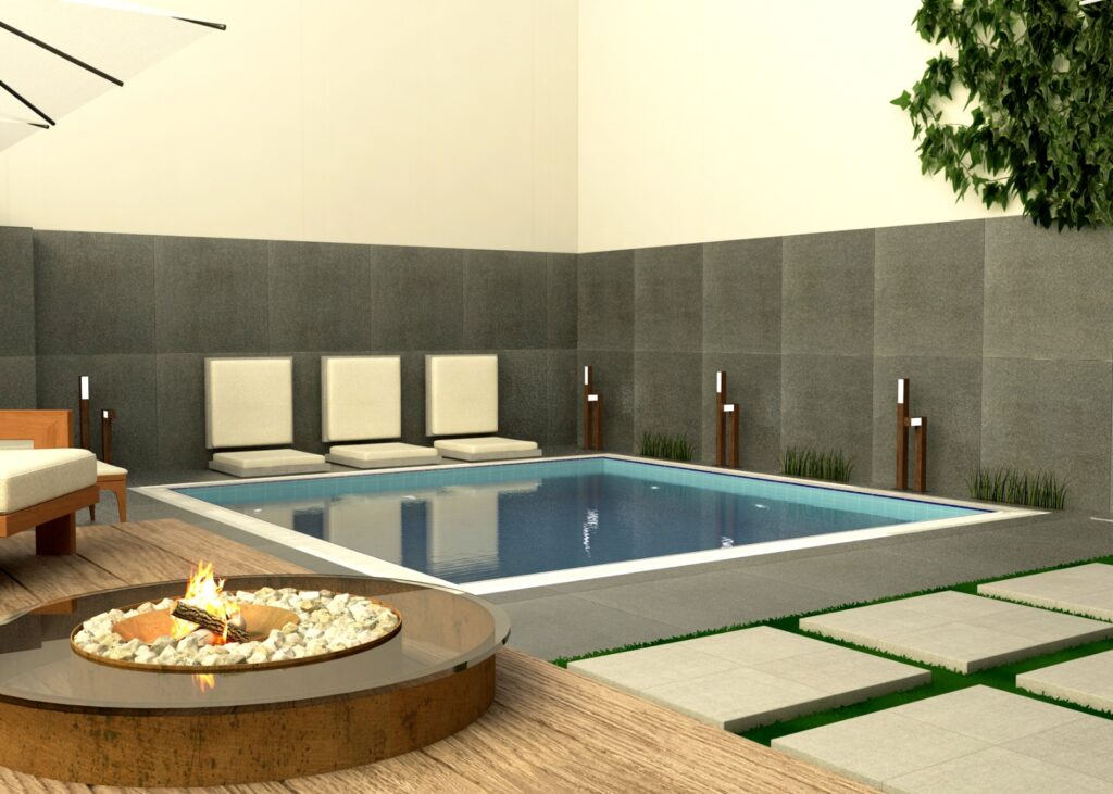 Küçük havuz, güneşlenme alanı ve bitkilerle tasarlanmış, modern havuz ve bahçe.