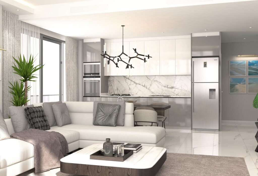 Açık Plan Villa Tasarımı Beyaz L koltuk ve modern mutfak adasıyla birleşen, aydınlık ve ferah bir açık plan yaşam alanı.