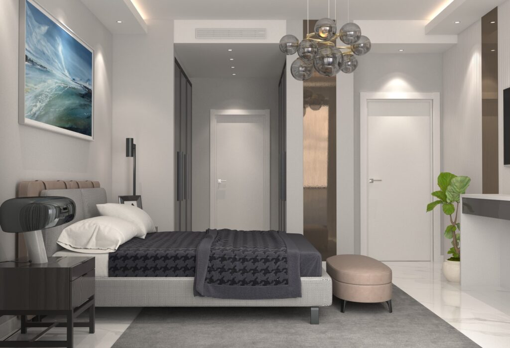 Açık Plan Villa Tasarımı Gri yatak, şık bir avize ve minimalist mobilyalarla tasarlanmış modern bir yatak odası.